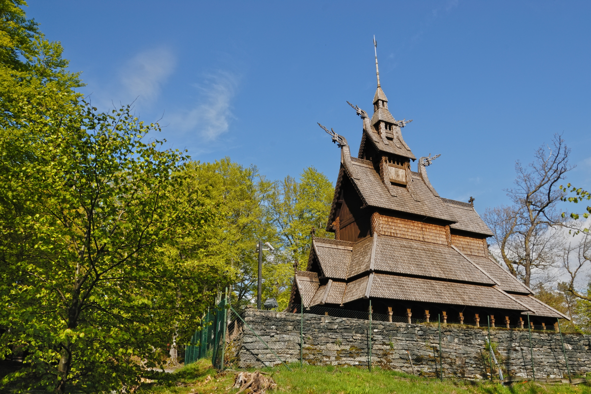 Fantoft Stave Church, originally built around 1150 in Fortun, was relocated to Bergen in 1883 to save it from demolition and has been reconstructed multiple times due to damage.