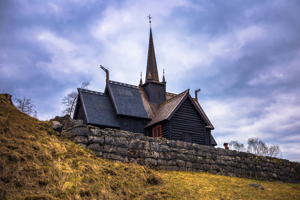 The Garmo Stave Church, originally built in the mid-12th century, was relocated and meticulously reconstructed at Maihaugen after being purchased by a local dentist in 1888.