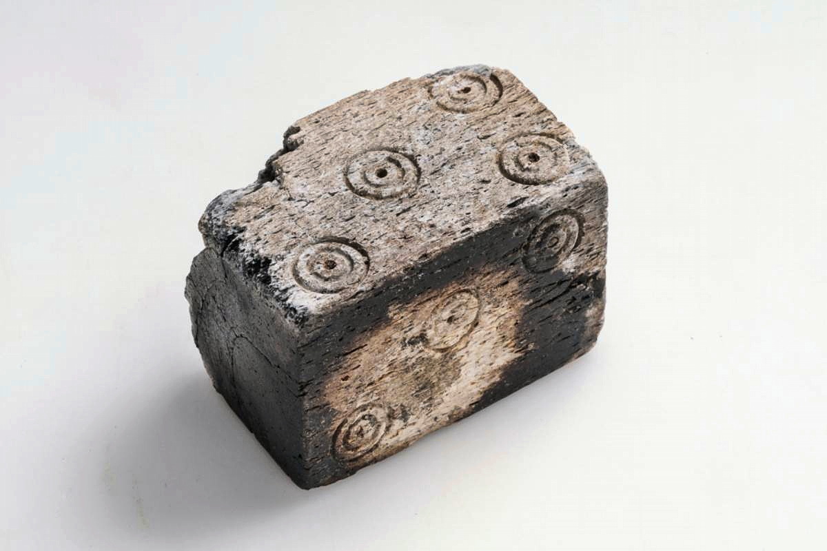 This bone or antler die, found in a grave in Sörby, Hölö, Södermanland, Sweden, was part of "We call them Vikings," an exhibition by The Swedish History Museum.