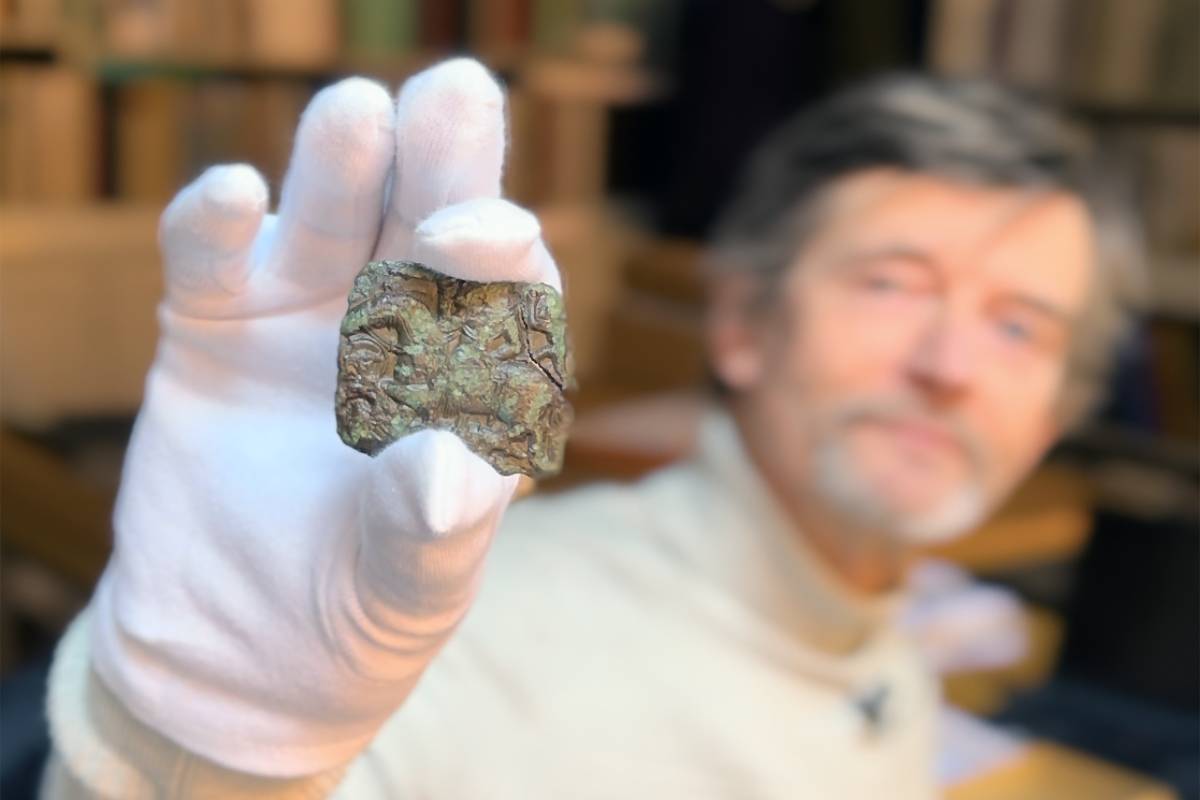 Archeologists are examining a small die found in Denmark that appears to share design elements with the Sutton Hoo helmet.
