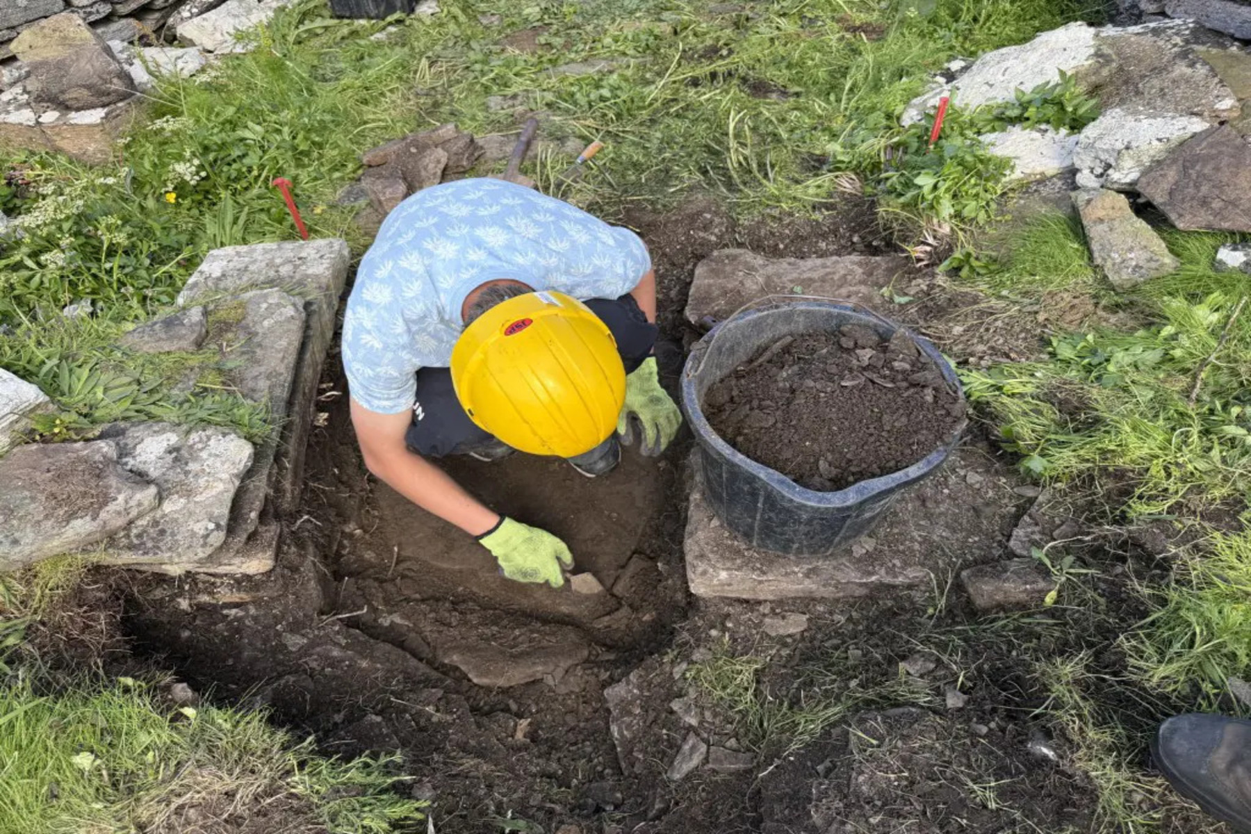 A pupil excavating part of the church in Swona. Source: Gordonstoun School