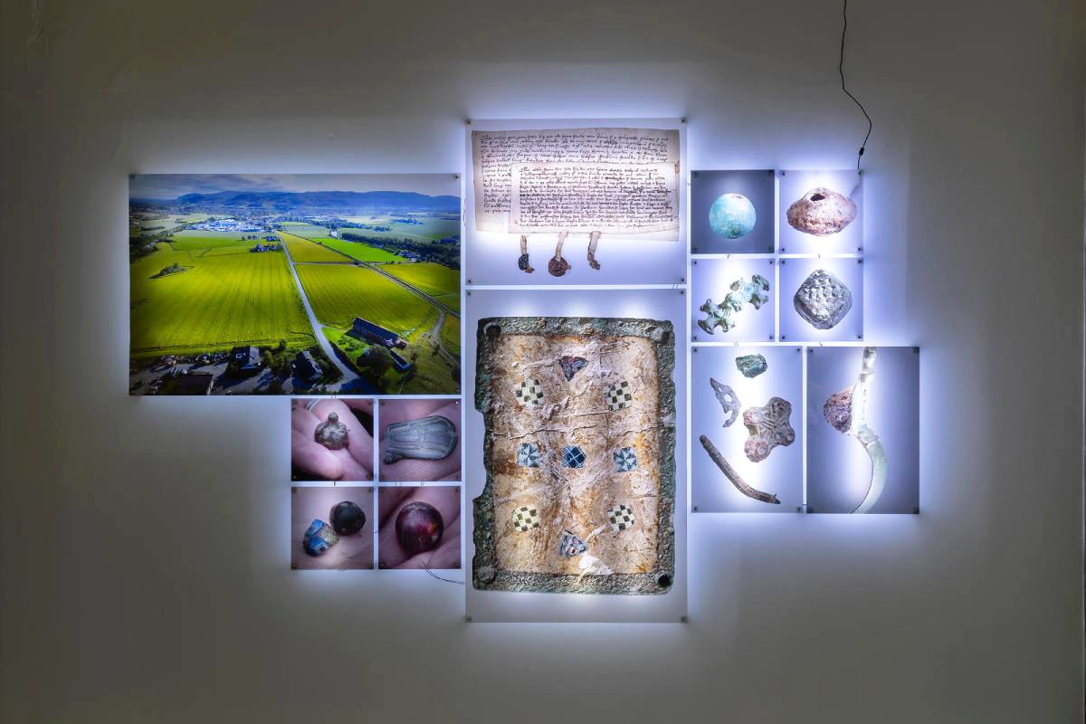 The Vestfossen Kunstlaboratorium exhibition melds archeology with anarchy, showcasing historical artifacts from Sem Farm in a punk-inspired context.