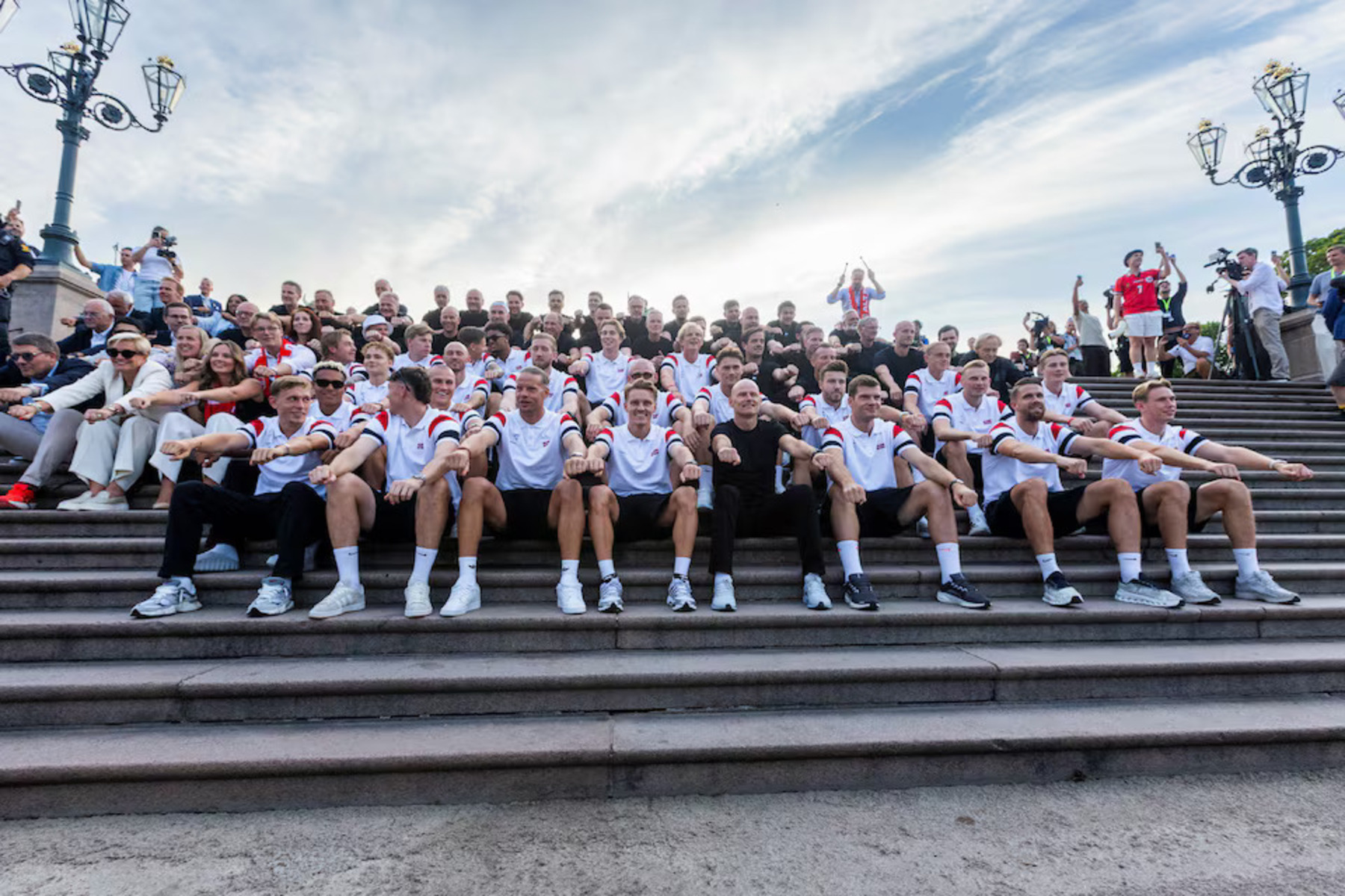 The Norwegian team rowing on the steps of the Royal Palace in Oslo, with Prince Haakon drumming in the top right. Source: Reuters